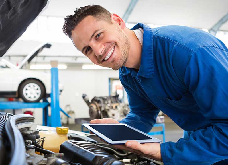 Service Technician working on a car