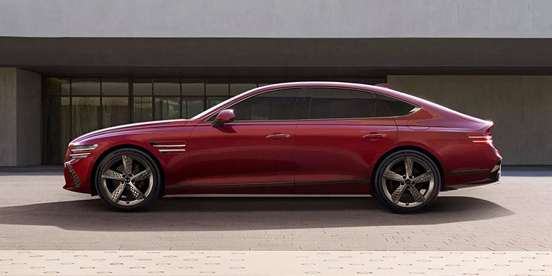A Genesis G80 Vehicle Parked In Front Of A Home
