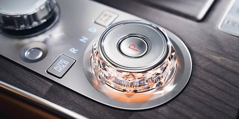 Gray 2027 Genesis G80 luxury sedan showcasing its sleek side profile, alloy wheels, and rear LED taillights.