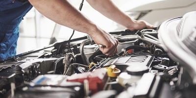 Service Tech working on a car